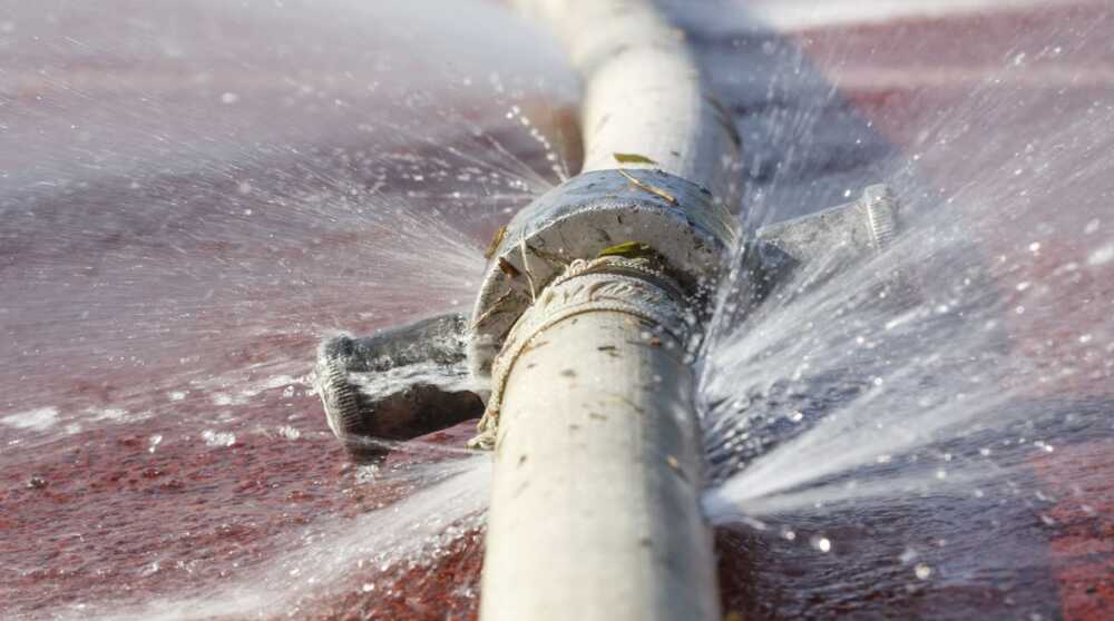 Water,Leaking,From,Hole,In,A,Hose Water,Leaking,From,Hole,In,A,Hose